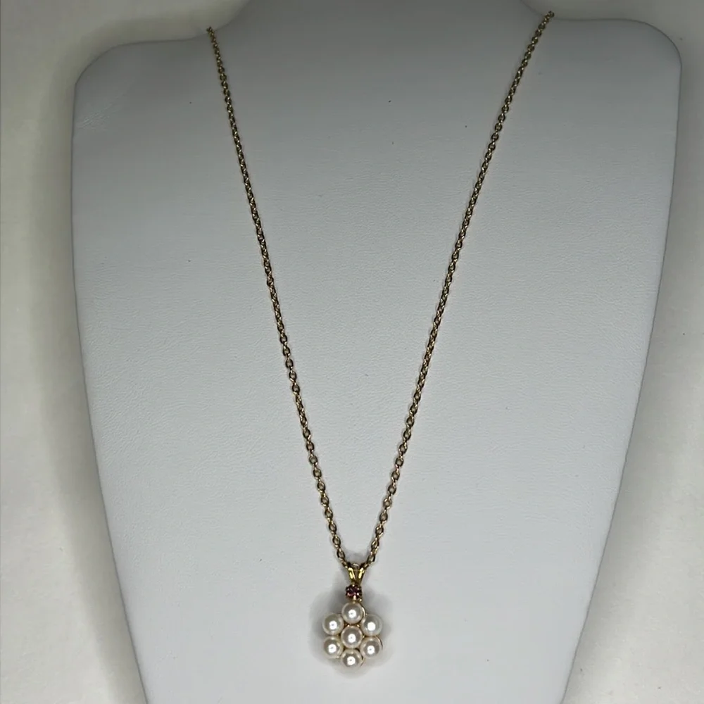 Avon gold tone pearl and garnet pendant.
